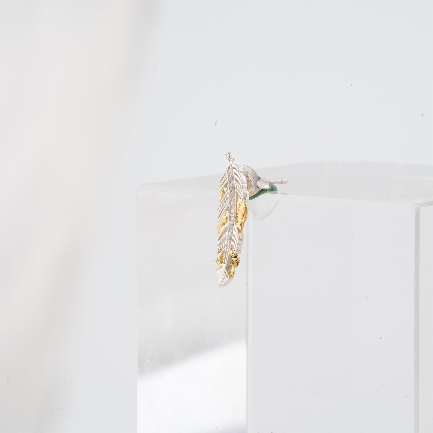 Feather stud earrings